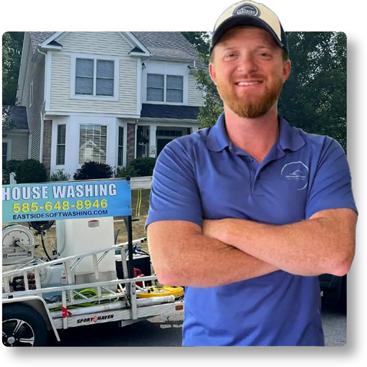 The owner of Eastside Softwash standing in front of the company's house-washing trailer